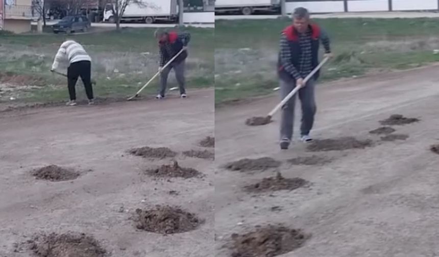 İş başa düştü! Eskişehir'de vatandaşlar sokaktaki çukuru kendi kapattı